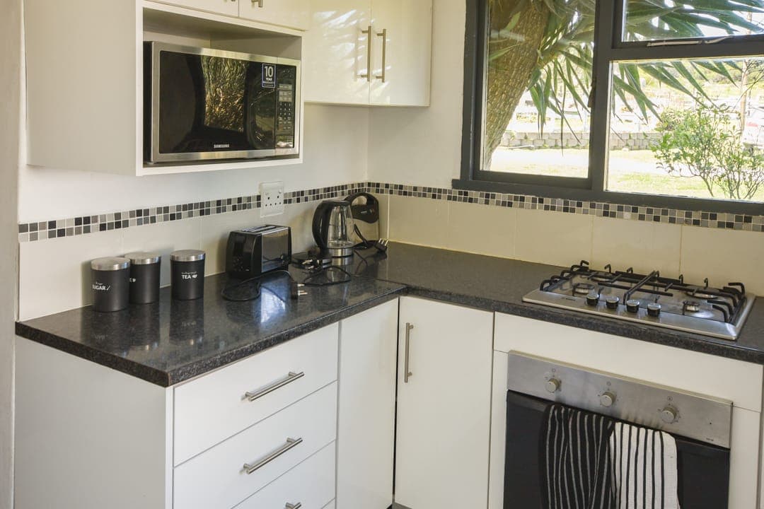 The gas hob, oven and kettle in the White House Cottage kitchen.