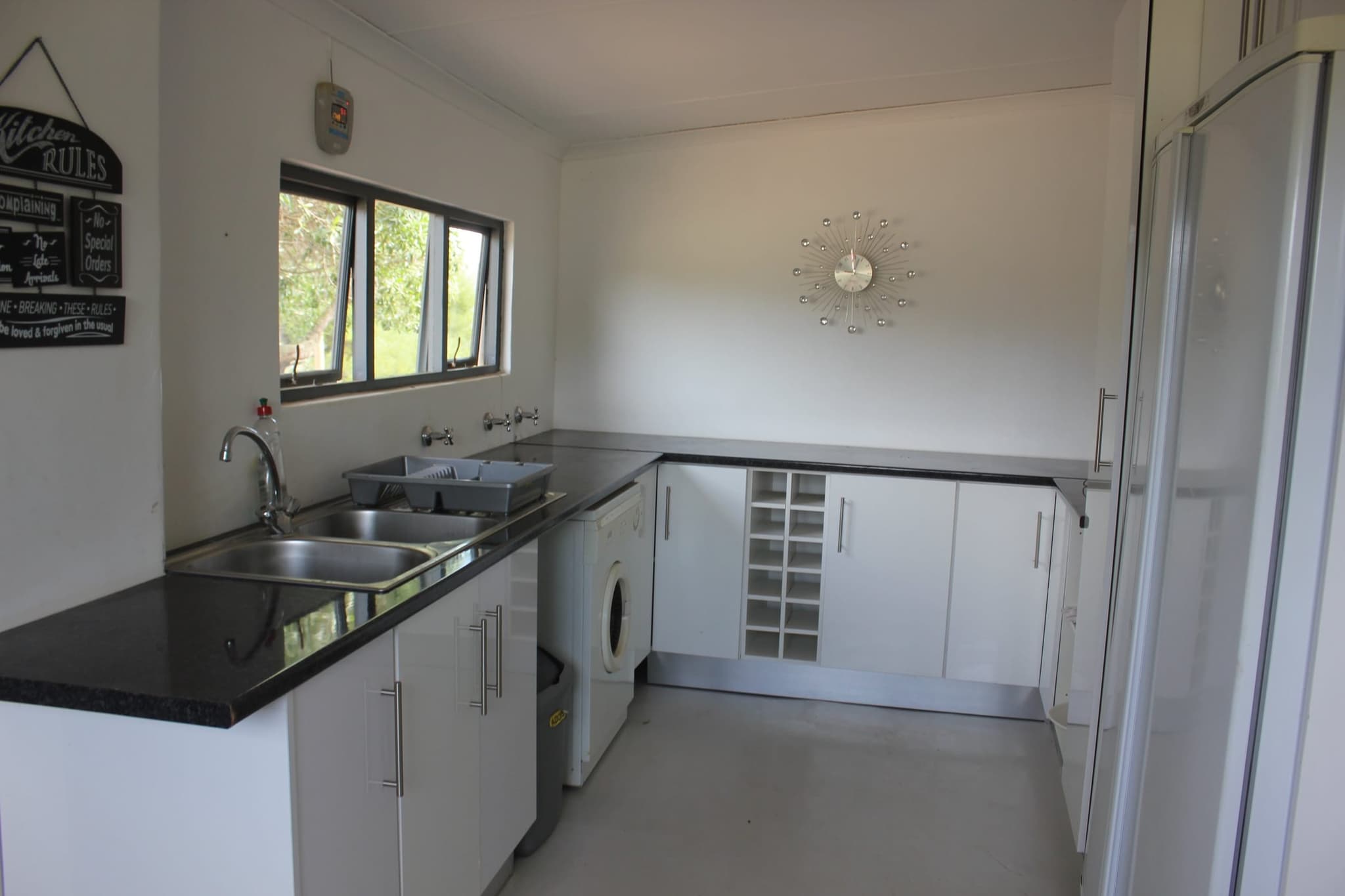 The White House Cottage kitchen, its window looking out over the Goukou River.