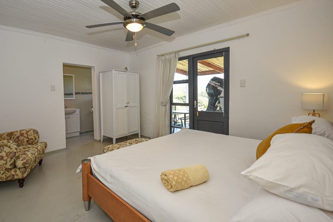 The en-suite master bedroom at White House Cottage, with a door straight out onto the veranda.