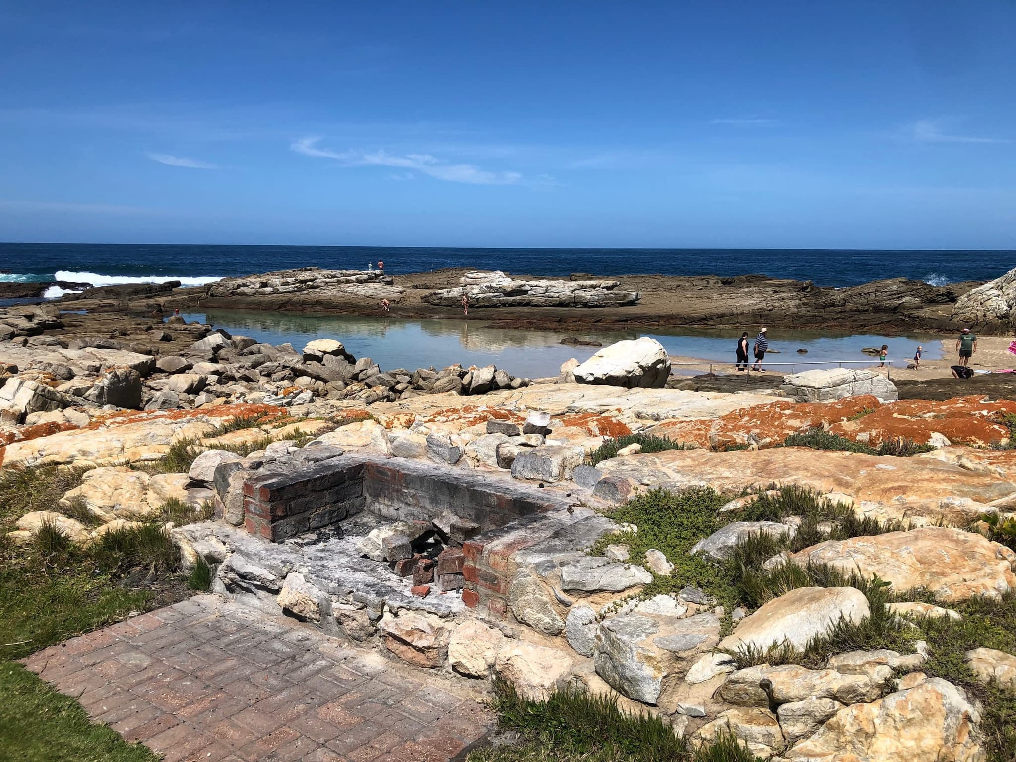 A tidal pool and rocky limestone shore on the Stilbaai coast.